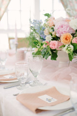 Table setting at a luxury wedding and Beautiful flowers on the table.
