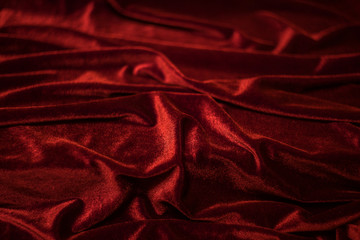 Velvet fabric with pleats as background.