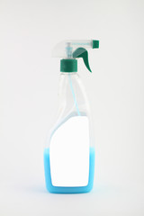 transparent plastic bottle with green spray nozzle, detergent for home frill isolated empty mock up on white background
