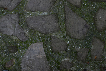Texture of stone wall made of grey stones
