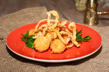 plate with cheese balls, hot appetizer for a party