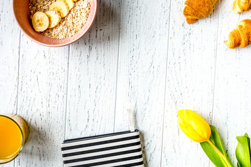 healthy breakfast with porridge on wooden background top view