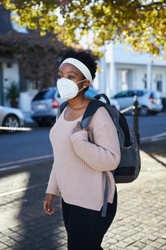 Woman wearing an N95 mask in the street