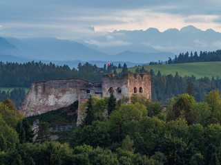 Castle in Czorsztyn against the background of silhouettes Tatra mountains, Poland