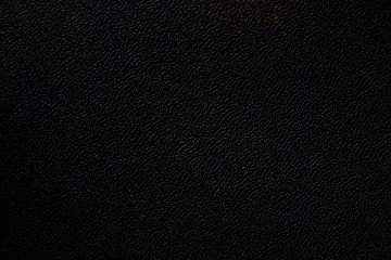 Texture of old worn black genuine leather.
