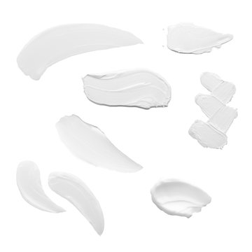 Swabs Of Creamy Textures. Strokes Of Body Lotion Or Hand Cream In Different Shapes And Sizes. Smear Of Skincare Cosmetics Product. Cosmetology Wellness And Beauty Concept. Isolated On White