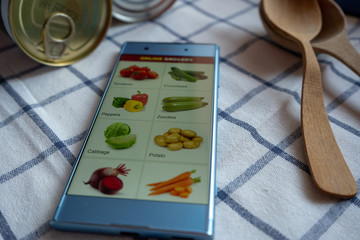 Shopping grocery in online store, ordering vegetables using smartphone app