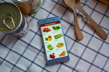 Shopping grocery in online store, ordering vegetables using smartphone app