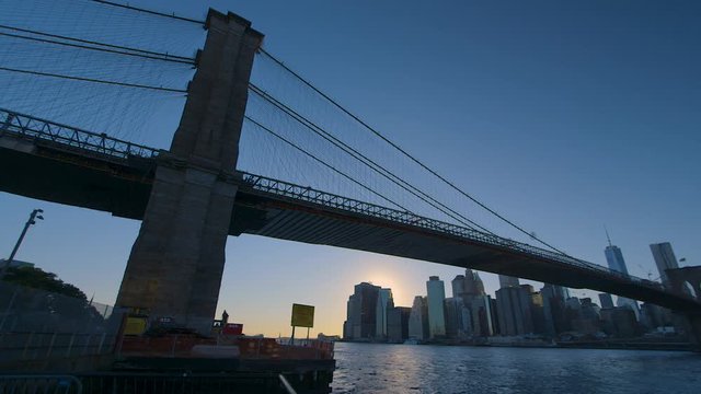 New York City - Extreme Wide Pan Right on Manhattan Skyline and Bridge.
