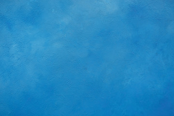 light blue painted house facade with spatula technique structure