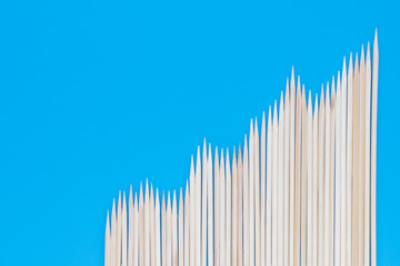 Thin pointed sticks on a blue background