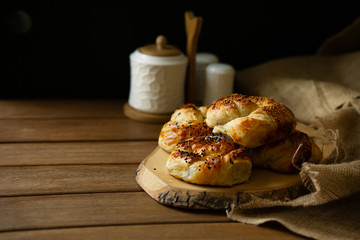 hot fresh turkish pastry on wooden tray with black background
