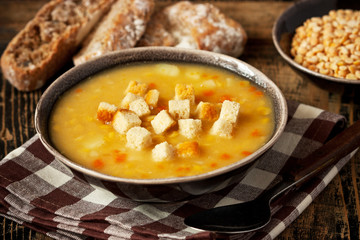 Bowl  with  pea soup and   croutons