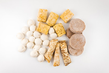 Frozen Food. Dumplings stuffed pancakes, meatballs isolated on a white background. Top view 