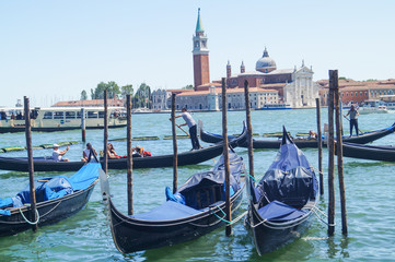 Fototapeta na wymiar Gondolas moored by Saint Mark square Venice, Venezia, Italy, Europe
