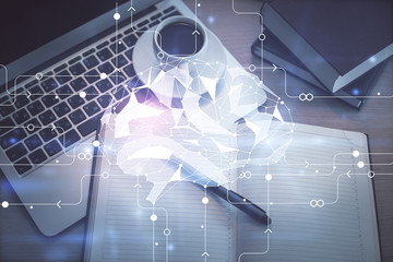 Double exposure of brain drawing hologram over topview work table background with computer. Concept of big data.