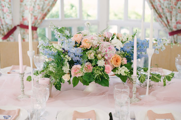 Table setting at a luxury wedding and Beautiful flowers on the table.