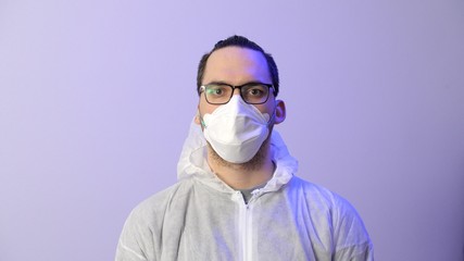 Portrait of man in a protective medical mask. Coronavirus or COVID-19.
