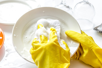 concept of woman washing dishes on white background