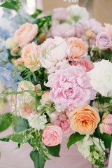 Wedding flowers, bridal decor closeup. Decoration made of peonies, roses and decorative plants
