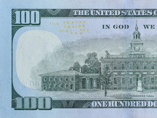 Independence Hall on 100 dollars banknote back side closeup macro fragment. United states hundred...