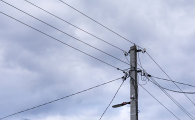 A power line pole with electrical wires isolated against the sky. Power line, power supply