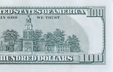 Independence Hall on 100 dollars banknote back side closeup macro fragment. United states hundred...