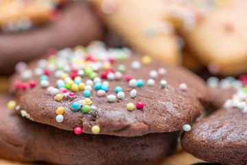 Chocolate and cream biscuits, closeup of tasty cakes