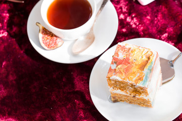 Beautiful and delicious honey cake in nature. Aromatic tea