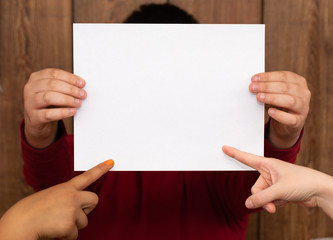 man holding blank paper with two people pointing
