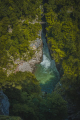 View of river Reka, flowing through UNESCO protected famous Skocjan Caves. Aerial view of the Skocjan caves with closeup of the river.