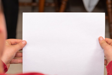 hands holding blank paper