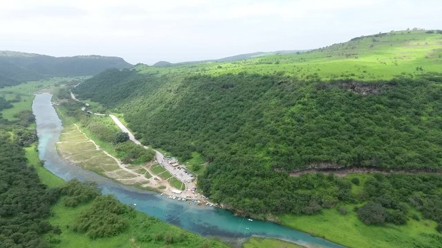 A surprising snapshot of the drone in the fall in Salalah, Ain Darbat, Sultanate of Oman 