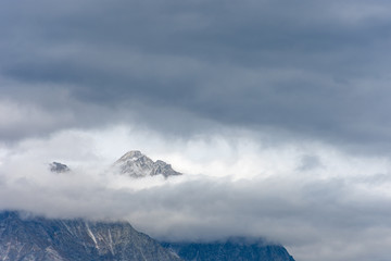 Snowy peak of the Dolomites that like Mount Olympus, in Greek mythology, stands out among the clouds