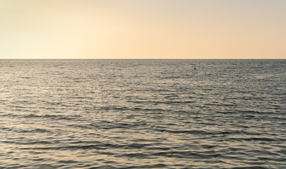 Sea waves at sunset warm color