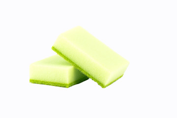 Two kitchen sponges isolated on a white background.