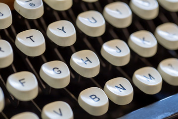 Close up of letters on an old fashioned typewriter keyboard