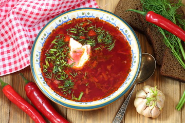 Still-life with borsch with vodka on a festive table