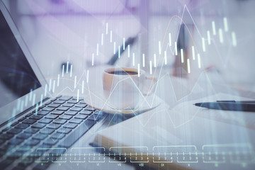 Double exposure of financial chart drawing and desktop with coffee and items on table background. Concept of forex market trading