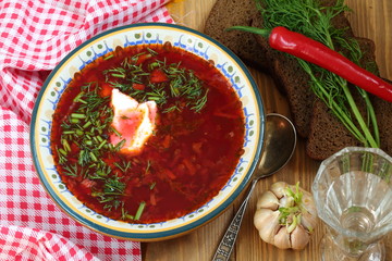 Still-life with borsch with vodka on a festive table