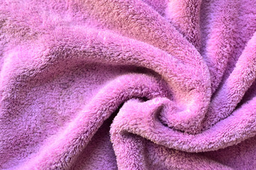 Naklejka na ściany i meble Soft fabric background. Terry towel, close-up. Soft fabric of pink, lilac colors. Texture.