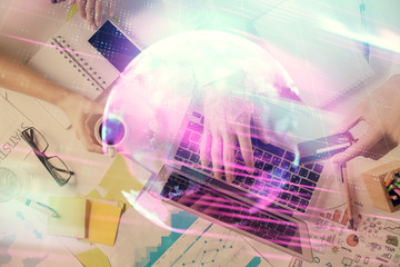 Double exposure of man's hands typing over computer keyboard and tech theme hologram drawing. Top view. Technology concept.