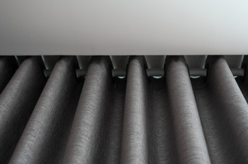 Beautiful grey curtain in daylight. Cozy room in home.