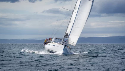 Foto op Canvas New sailing yacht going fast and beautiful directly on the camera. Sailing regatta in Scotland waters. © AlexanderNikiforov