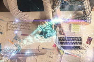 Double exposure of man and woman working together and technology theme drawing. Computer background. Top View. High tech concept.