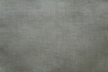 Fototapeta na wymiar Background of grey natural cotton fabric. Natural pale green linen texture