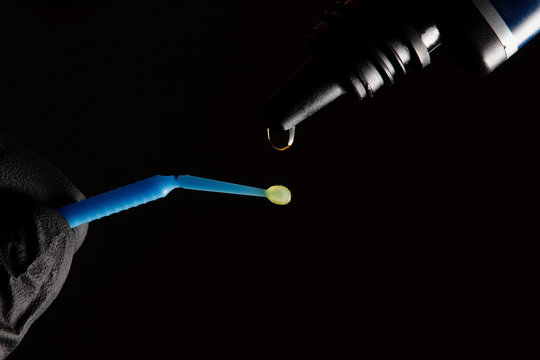 adhesive drop and dental brush
