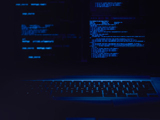 code and keyboard  blue background ethical hacking concept 