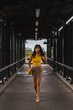 fashionable woman at train station