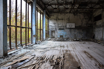 Fototapeta na wymiar basketball hall destroyed old ancient broken wooden floor tchernobyl ucraine